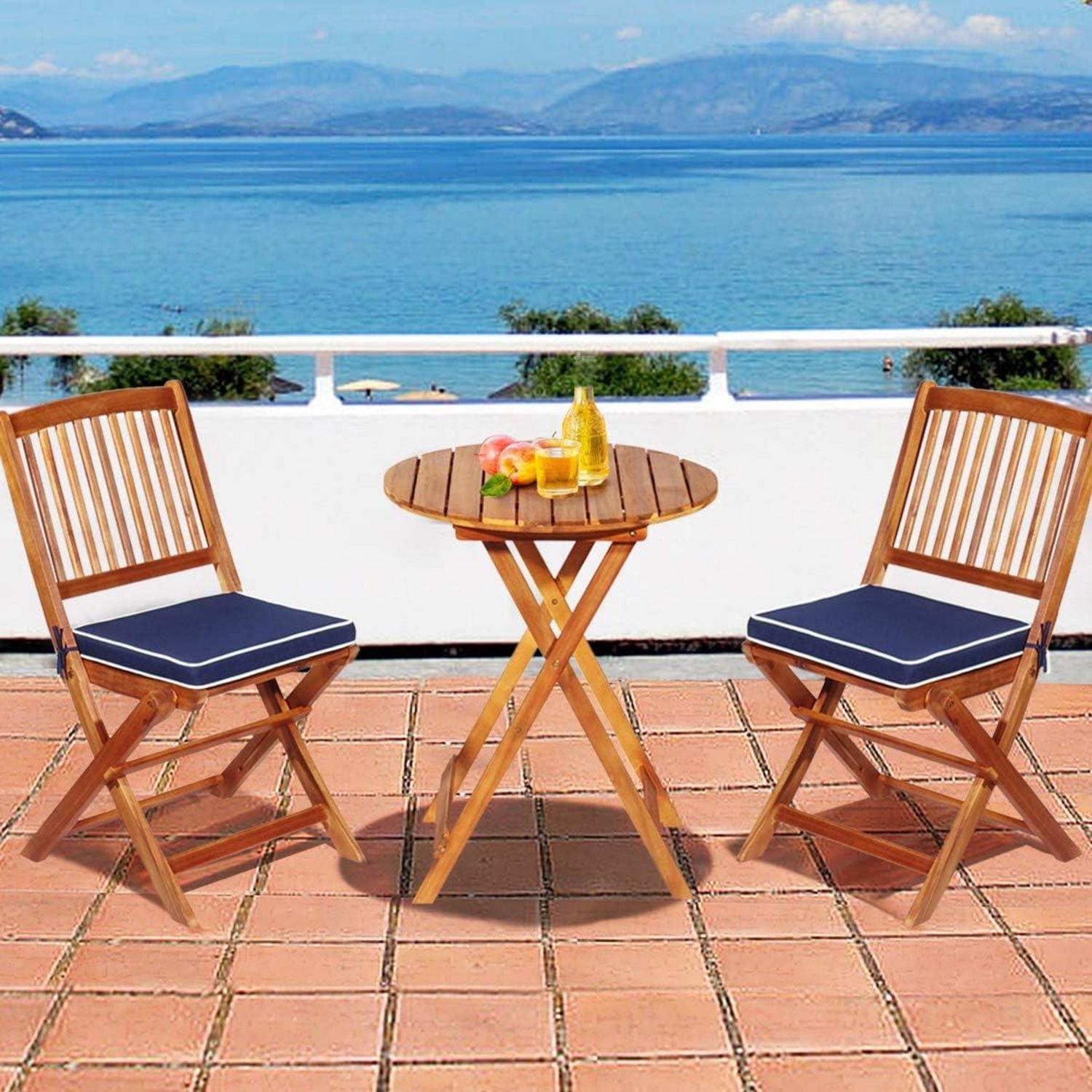 Gartenmöbel Set Akazienholz klappbar Rundtisch Stühle Kissen Blau